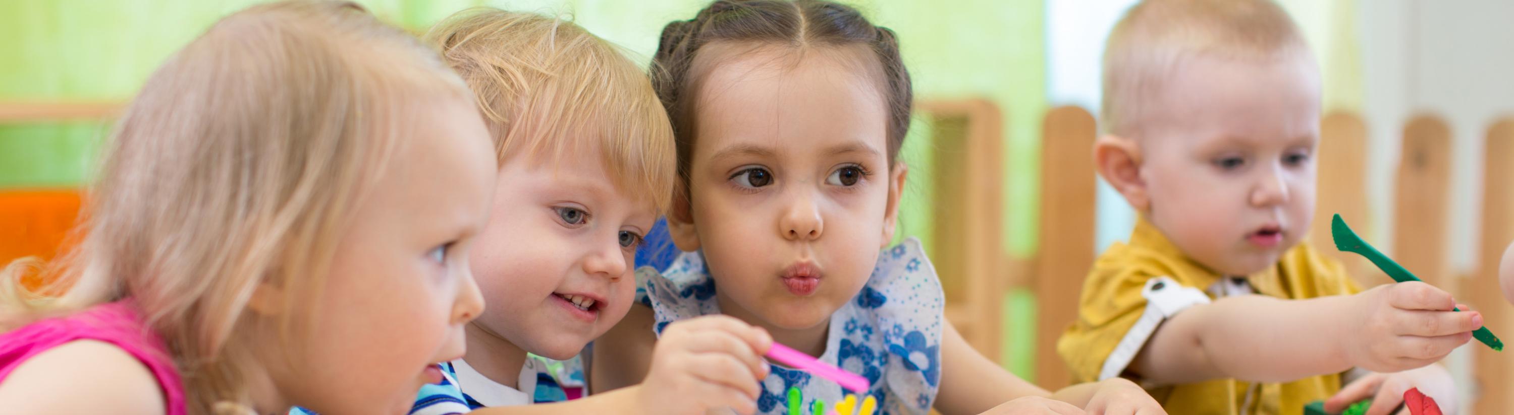 Children grouped together at a table