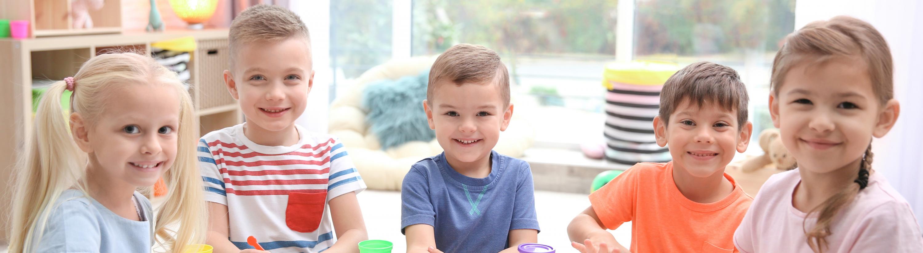 Children grouped together at a table